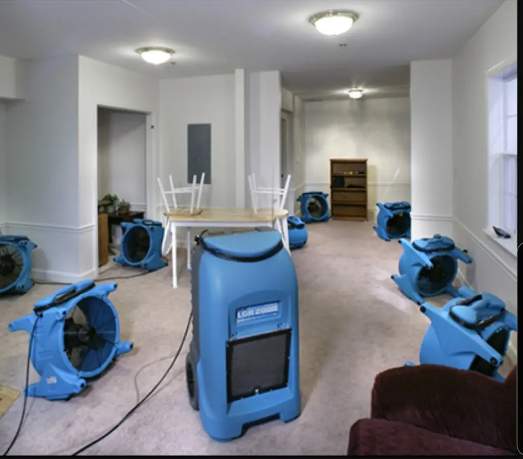 Air movers and dehumidifier setup for Water Damage Restoration in Belpre